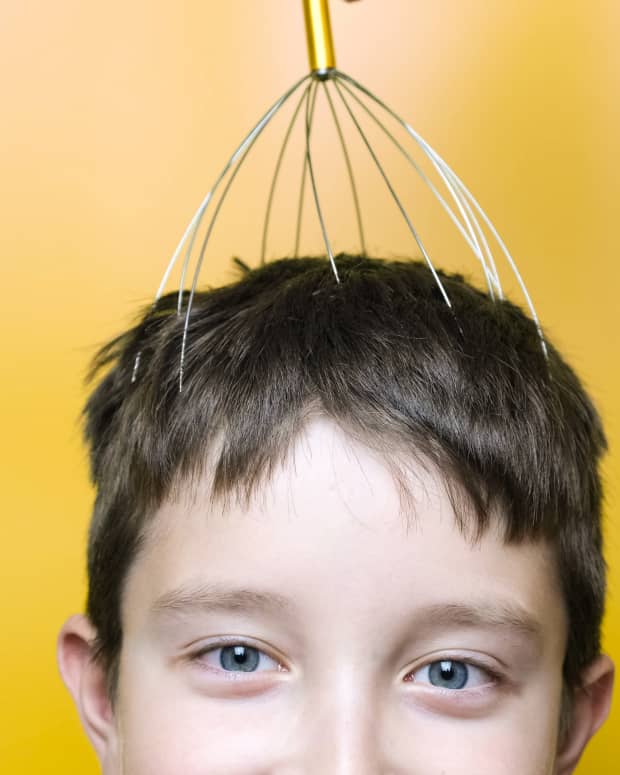 kid with headscratcher on his head
