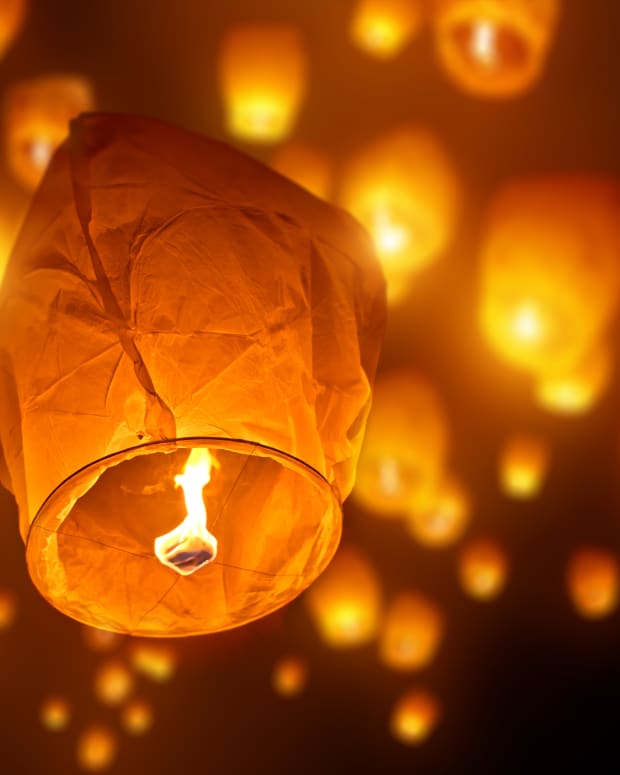 Paper lanterns flying into the night sky
