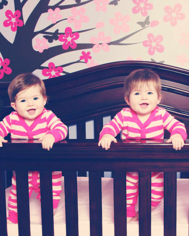 twin baby girls in their crib
