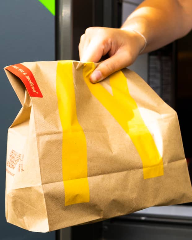 Worker Holding a McDonald's Bag