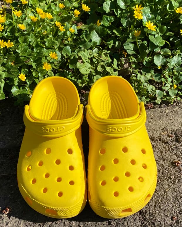 yellow crocs on pavement