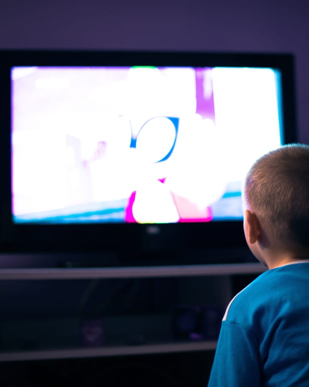 little boy watching cartoons
