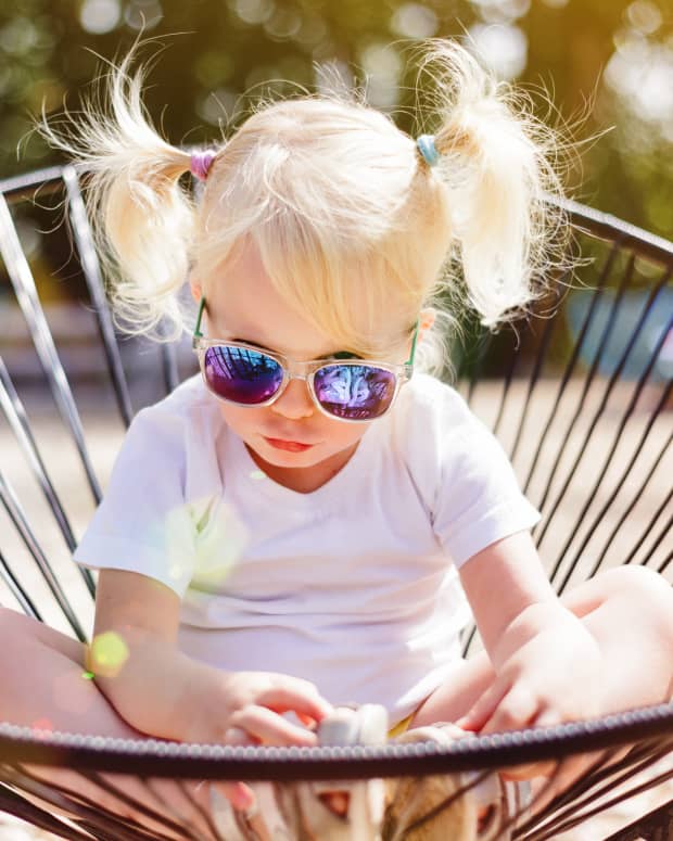 sassy toddler wearing sunglasses