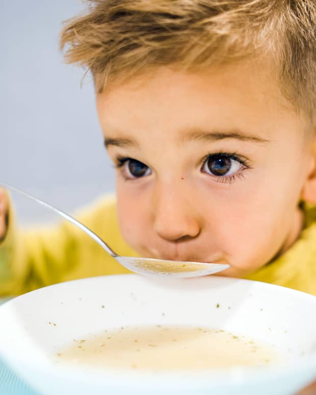 toddler eating soup