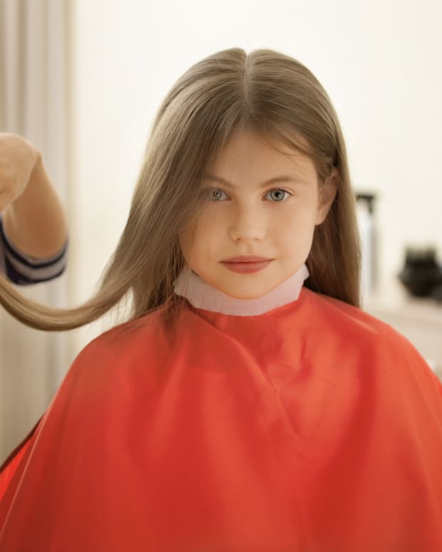little girl getting a haircut