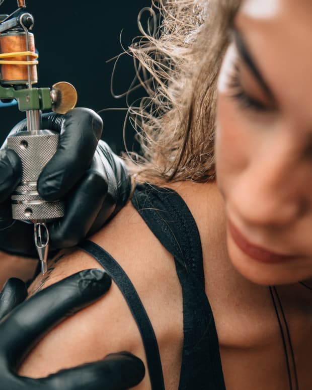 woman getting a tattoo