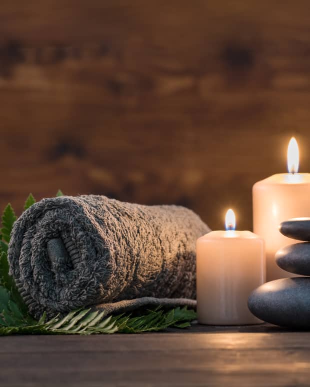candles with towel in spa