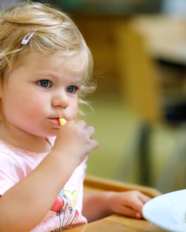 toddler eating at a restaurant