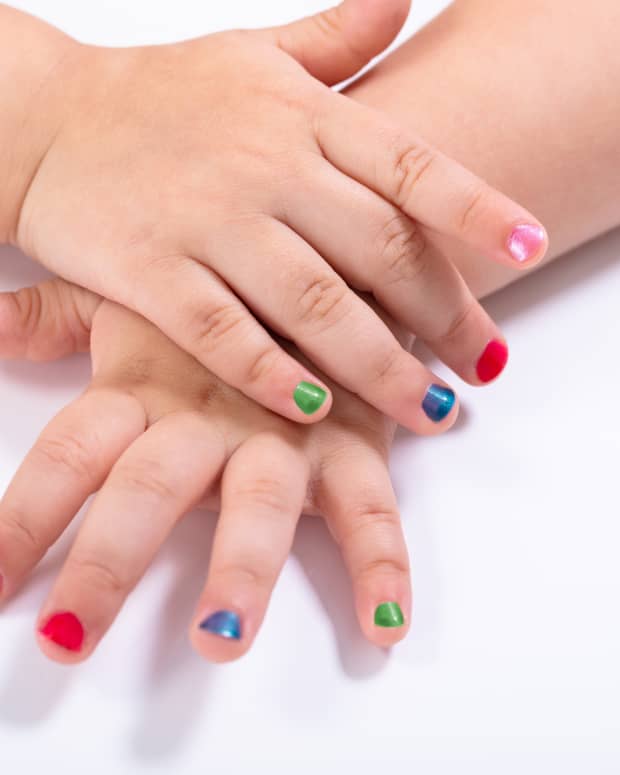 little girl with painted nails