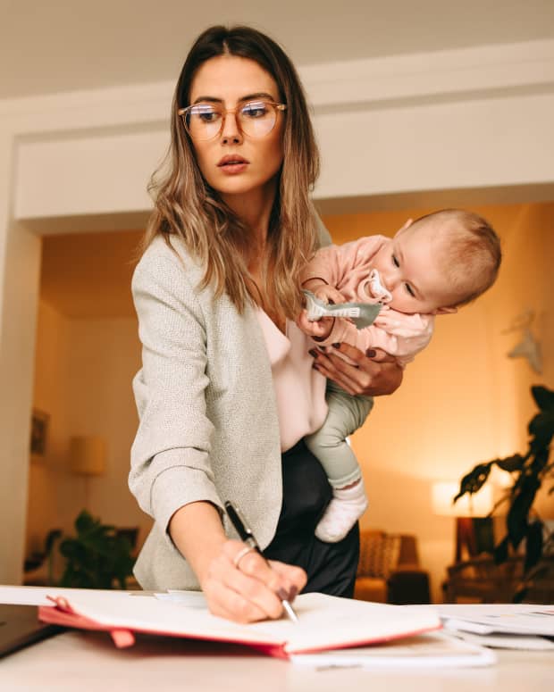 working mom holding a baby