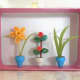 Put the pots of flowers in a display box and they look beautiful!