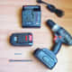 Cordless drill. A 1/4" hex driver is needed to install sheet metal screws.
