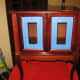 Before photo, with painter's tape around glass.