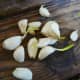 Garlic cloves ready to be planted. For the best results, seek out certified cloves from reputable garden centers, or use organic cloves from the grocery store. 