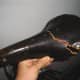 This dry, rotten leather seat is falling apart; the leather is breaking apart because the fibers are so dry and crumbly.