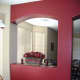 I painted this red accent wall between my formal dining room and kitchen area to create a visual division between the two areas.