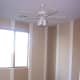 This is our guest room before any furniture was moved in. The vertical stripes add height to a small room, and the neutral colors leave room for various types of decor.