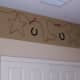 You can create a border with one thick horizontal stripe along the room's ceiling. This is easy to do and draws the eyes upward, making the room look taller.