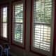Even large windows with shutters or blinds can be surrounded by a colored paint border.