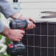 Use a screw driver to remove the screws holding the top of the condenser unit in place.