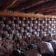 Earthship interior rammed earth tire walls before mudding.