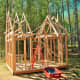 Use wood drops to keep the trusses in place after nailing them into position.