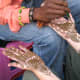 henna or mehdi being applied on the hands