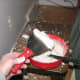 Load the mud knife with a glob and start to fill in the area to repair