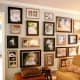 Here's an example of not sticking with the traditional &quot;hang pictures (only) at eye level&quot; thinking - I think this photo wall is dramatic and exciting. I love it!