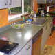 Ugly Formica countertops and faux-finished laminate cabinets.