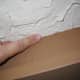 Use your finger (gloves optional) to smooth edges of room. I didn't do this on my first ceiling and I'm going back to do it this summer. This makes it look more like the ceiling was finished this way originally.