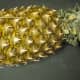 Take any a fresh pineapple. Any type will do that you can find at the grocery store.