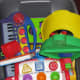 Larger toys are placed in a storage container with a lid.