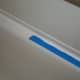 Remove the tape. Notice the hard edges on the caulk. You can leave it, or move on and remove all tape and use your finger to feather the edges out by doing the same method as used with pulling the caulk over the seam the first time.