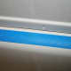 Place the tape along the tub lip, leaving a slight gap between the tape and the shower lining seam.