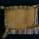 Once the sides are tacked down, continue to pull the fabric taught and staple along the edges. Gather the fabric on the corners last, and staple them tightly to the base.