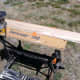 The workpiece is clamped (with the orange "dogs") onto a workmate bench.
