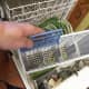 Original silverware basket has four slots. My old one also fit in and I kept it like many people on reviews suggested. However, I eventually decided to use the one that came with the washer and put bigger items in the top rack.