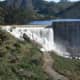 Concrete-lined dams create sheets of shallow water that heat up and evaporate, instead of sinking into the ground to refill the aquafir.