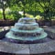 The large, formal fountain is the focal point of the test garden's central plaza.