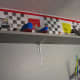 Later we added a shelf in front of the Lego wall d&eacute;cor so my son could display his creations.