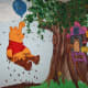Pooh pretending to be a cloud. My wall mural ideas came from children's book illustrations.