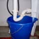 Place a bucket under your trap to catch the water.