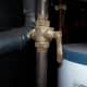 This valve is on. When the handle is sideways to the line, it is off.