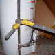 Here you see how the wrenches are applied to "break" the union so that you can take apart or finish up your gas line.