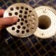 Uncovered Shower Drain. Take off the drain.