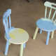 Some chairs in need of fresh paint.
