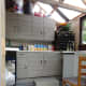 The new floor tiles laid over the old concrete slabs