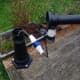 Lamppost plugged into mains via weatherproof 240v caravan plug and socket coupling.