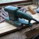 Cleaning the cut timber with a sander.